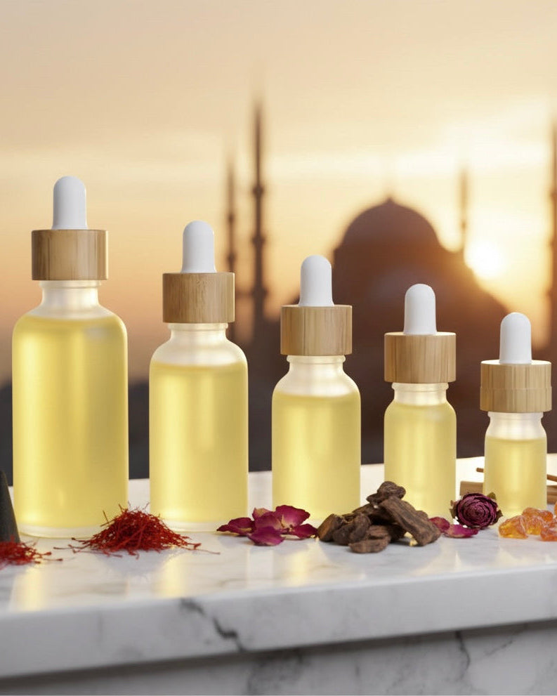 Five dropper bottles with a natural product setup on a marble surface.